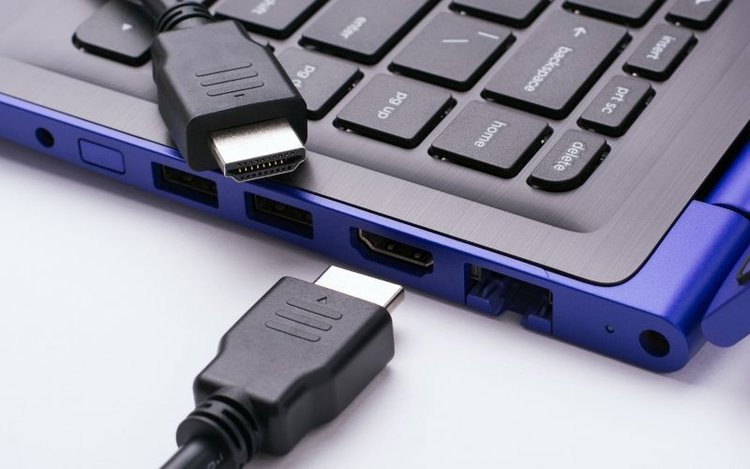 HDMI cables near HDMI port on laptop