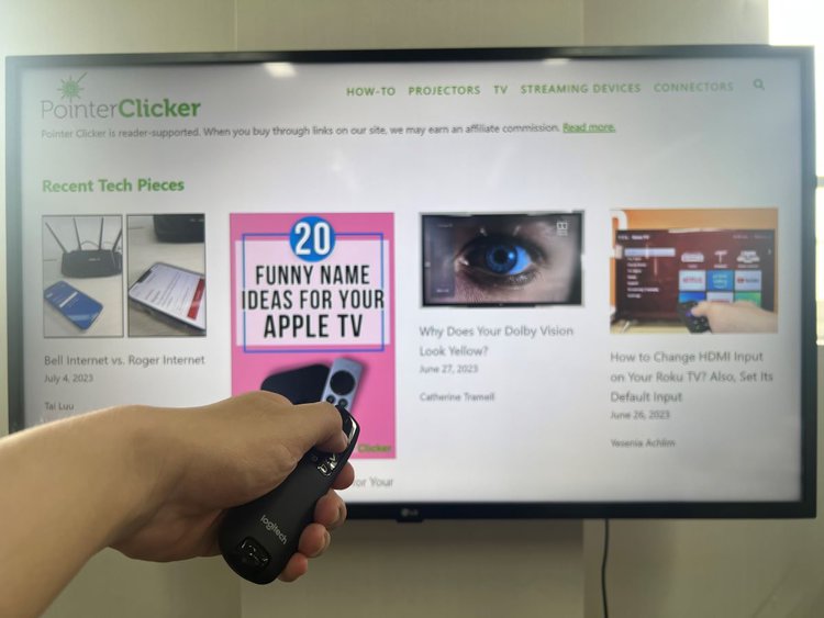 R400 laser pointer being pointed at an LG TV with pointerclicker website