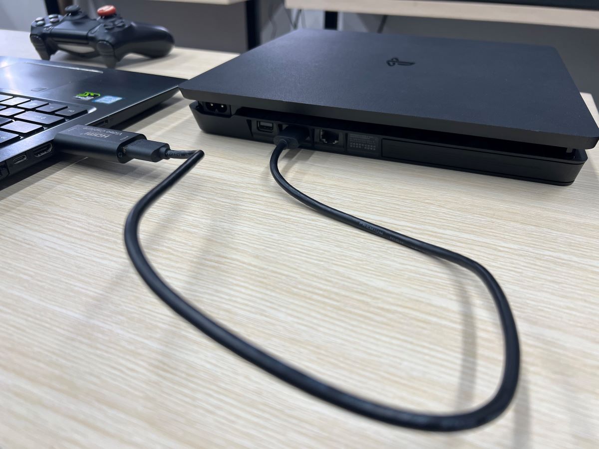 The PS4 console is connected to Asus laptop to use it as a display via an HDMI capture card