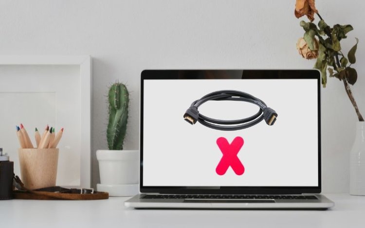 a black HDMI cable and rex X on Macbook