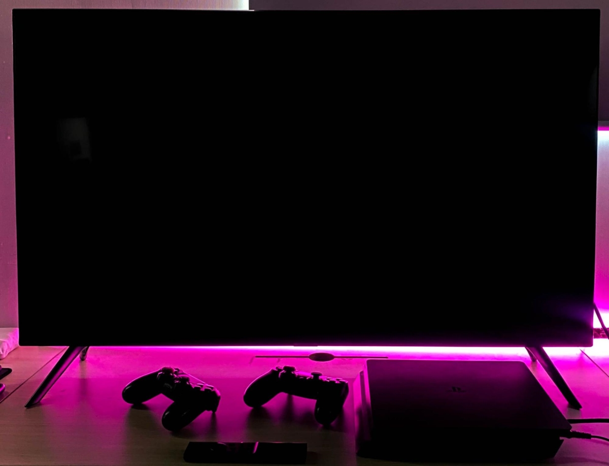 a black screen TV along with a PS4 console