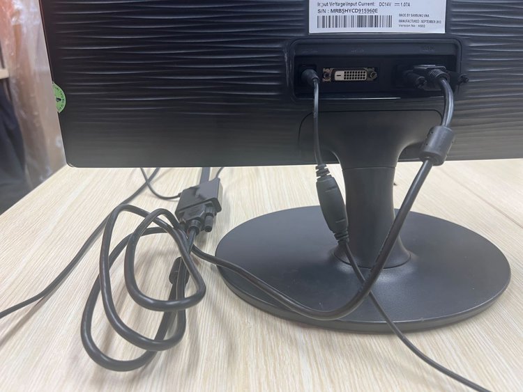 A VGA cable is connecting to a monitor via the VGA port