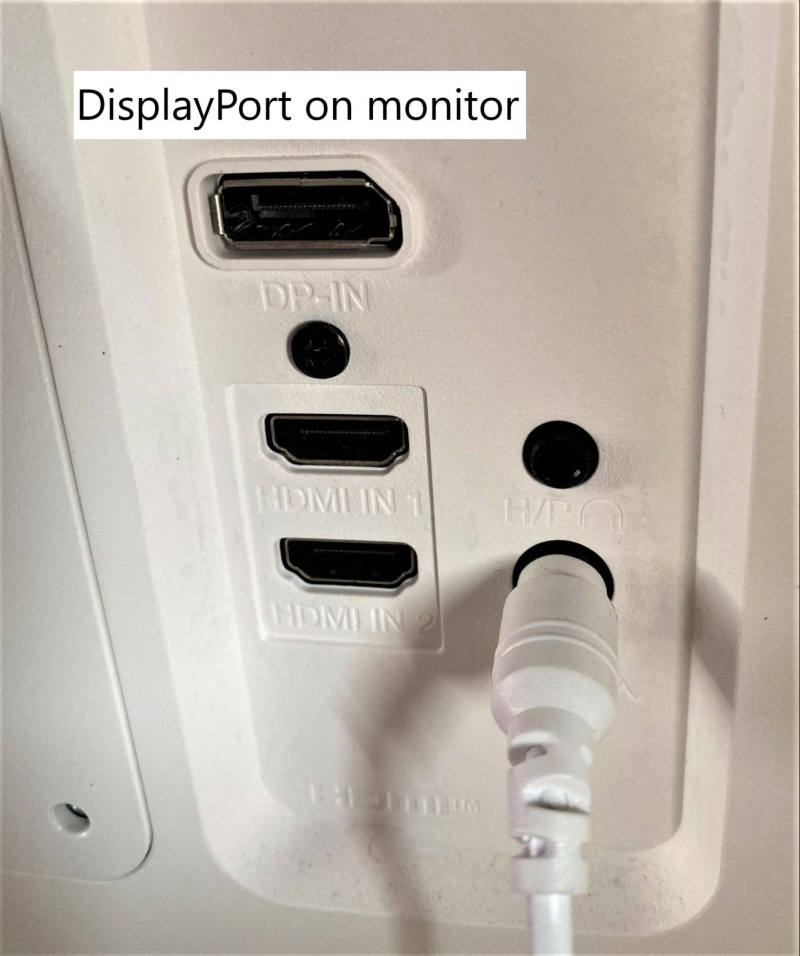 pointing to the DP port on a monitor