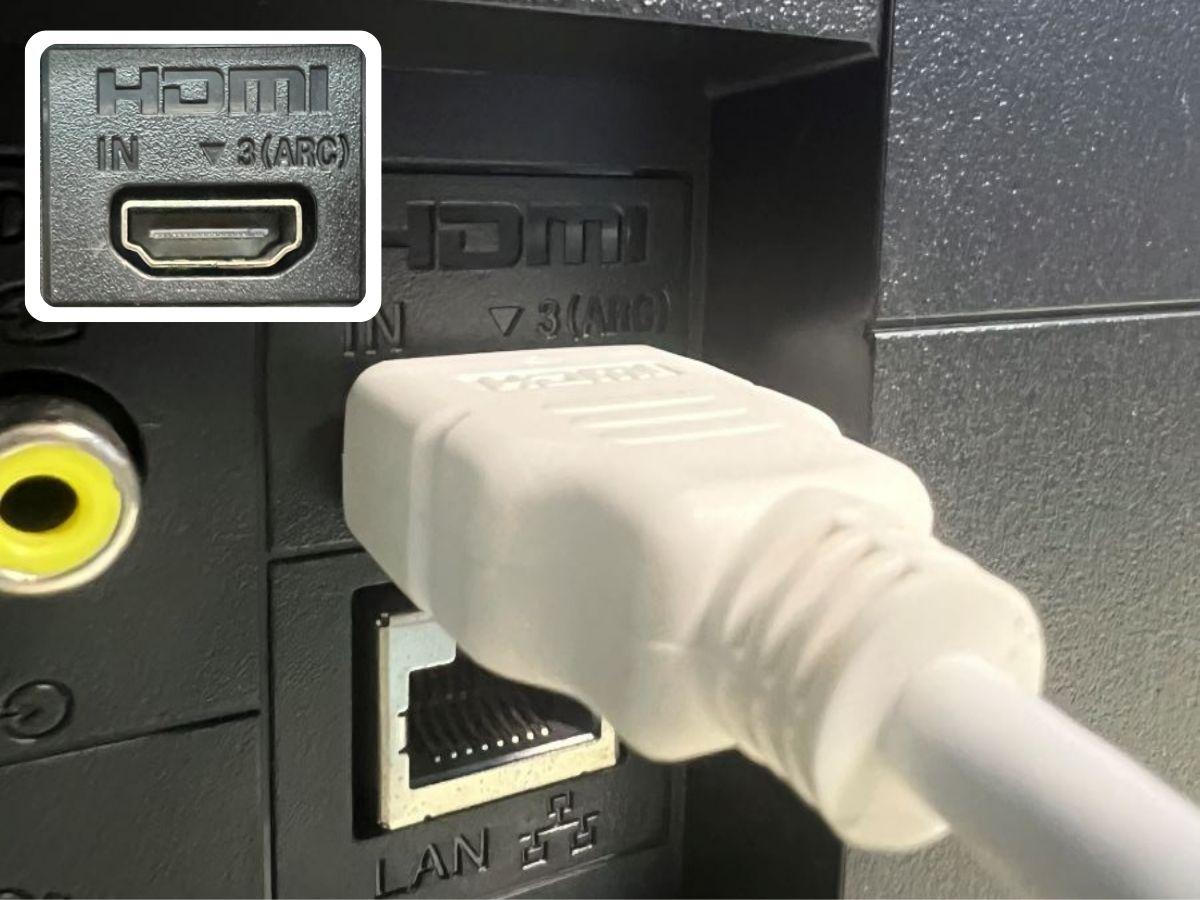 A White HDMI cable is plugged to the HDMI ARC port at the back of the Sony TV
