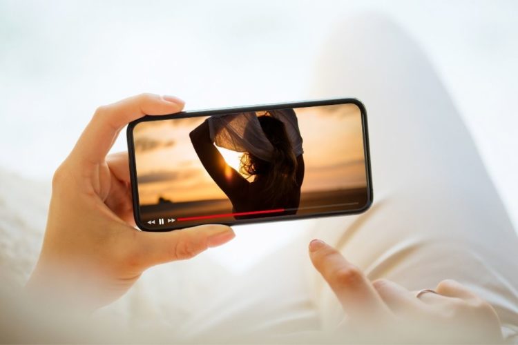 A man watching Youtube on smartphone