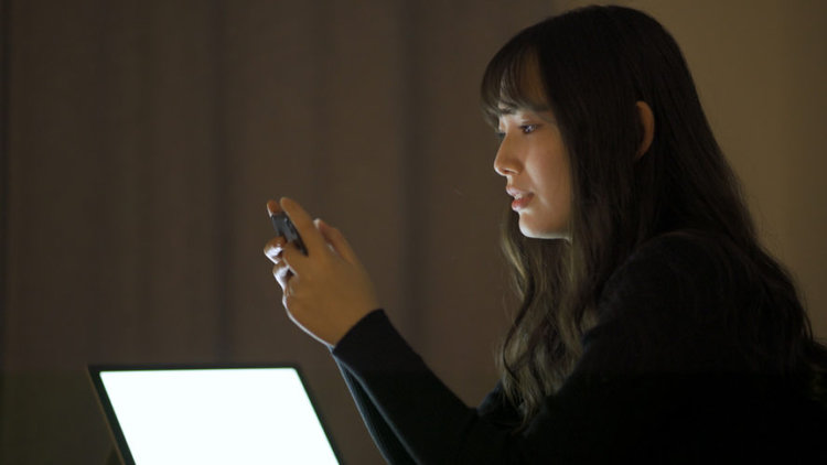 A woman streaming Anime on her devices