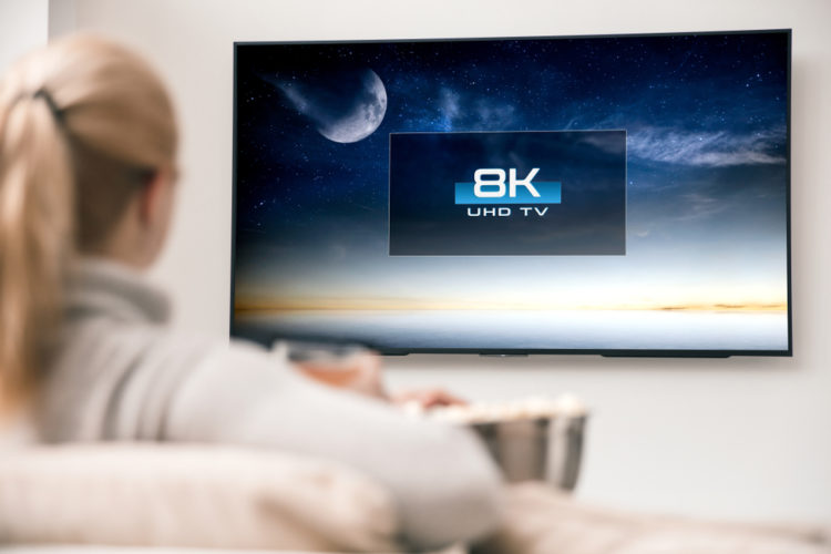 A woman watching 8K TV