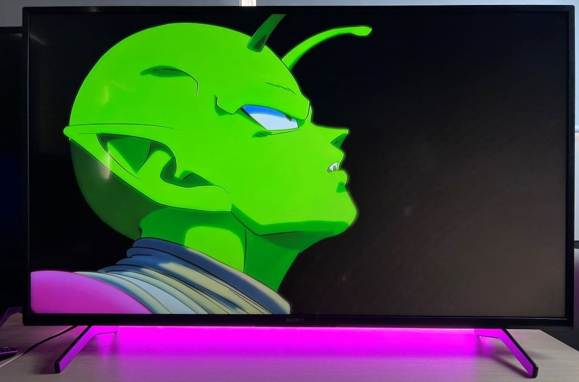 Songoku anime showing on TV with pink backlight