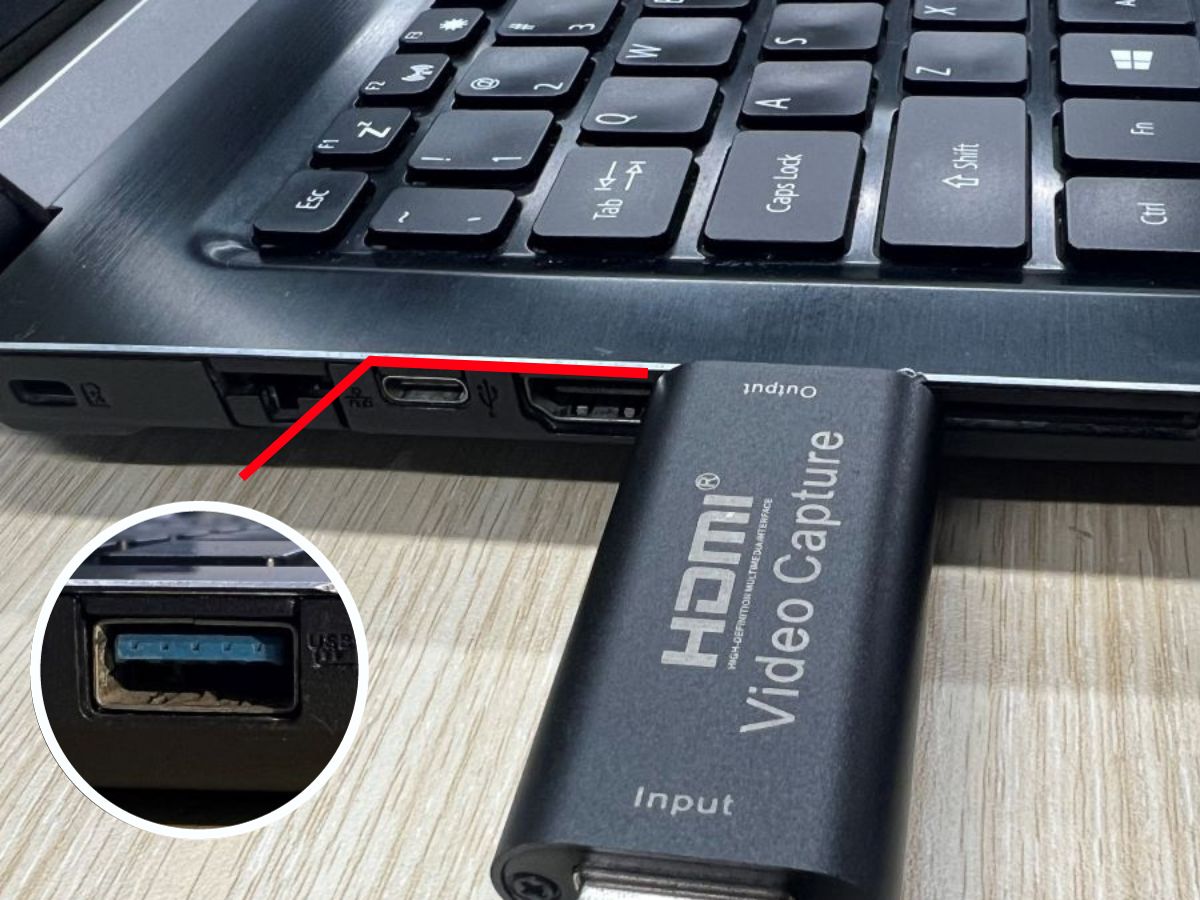 The capture card is plugged into the USB port of the Asus laptop
