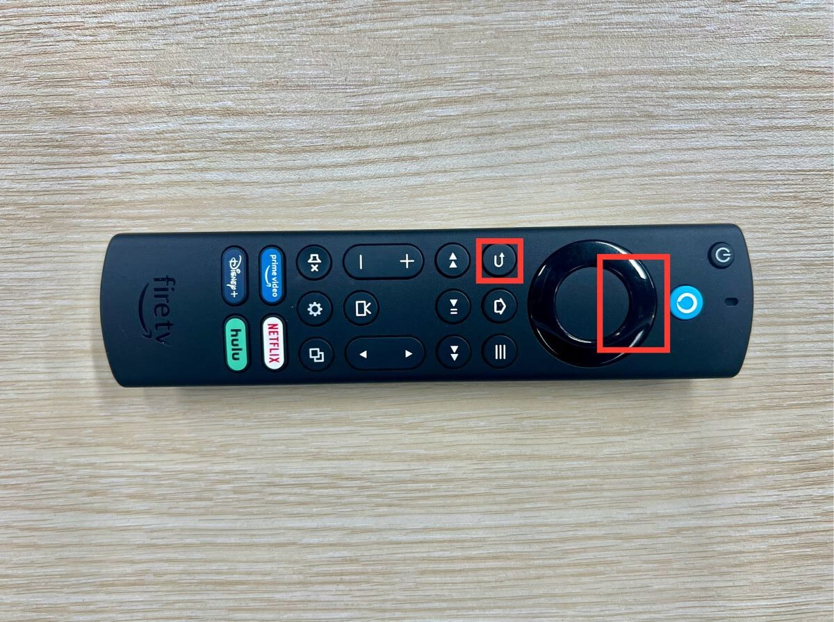 up & rewind buttons are highlighted on a fire remote