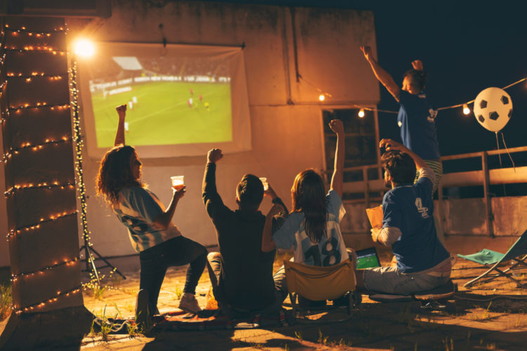 A group of friends watching entertainment together