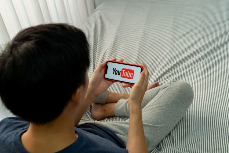 A man watching youtube on his phone