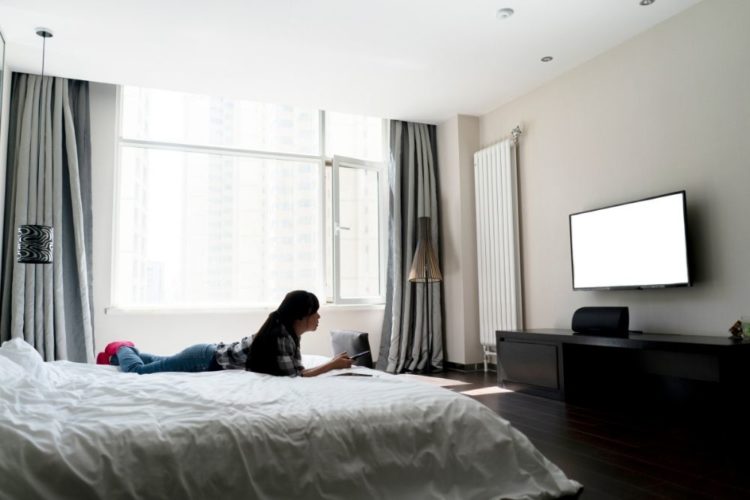 A woman streaming film in the hotel