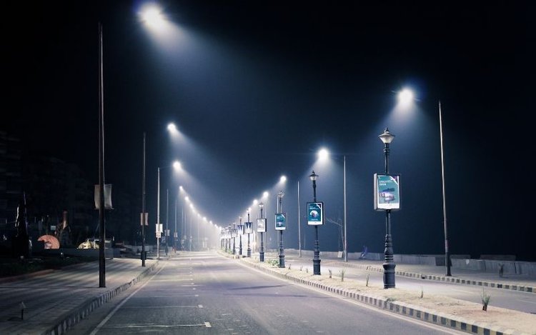 Bright empty road at night