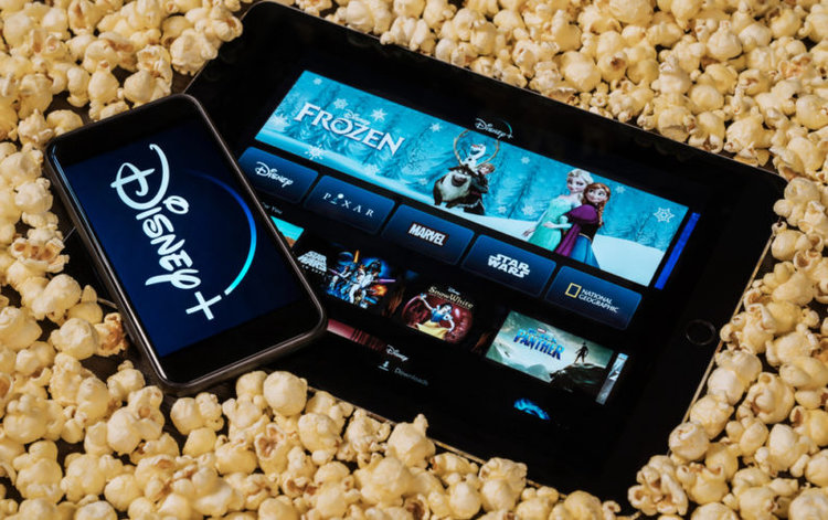 Disney Plus on smart devices and popcorn