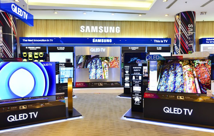 Q LED Samsung TVs are showing in a store