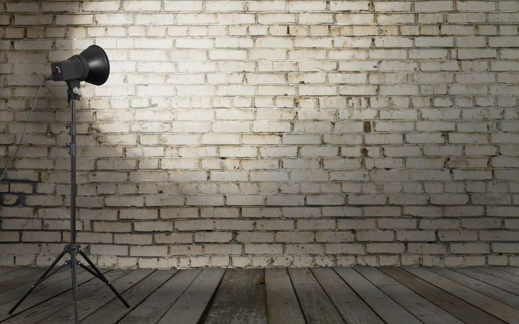 Spotlight on brick wall