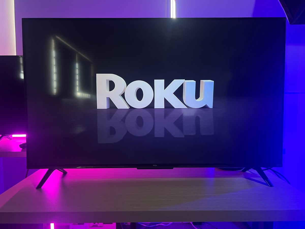 The TCL Roku TV reboost and showing the Roku icon