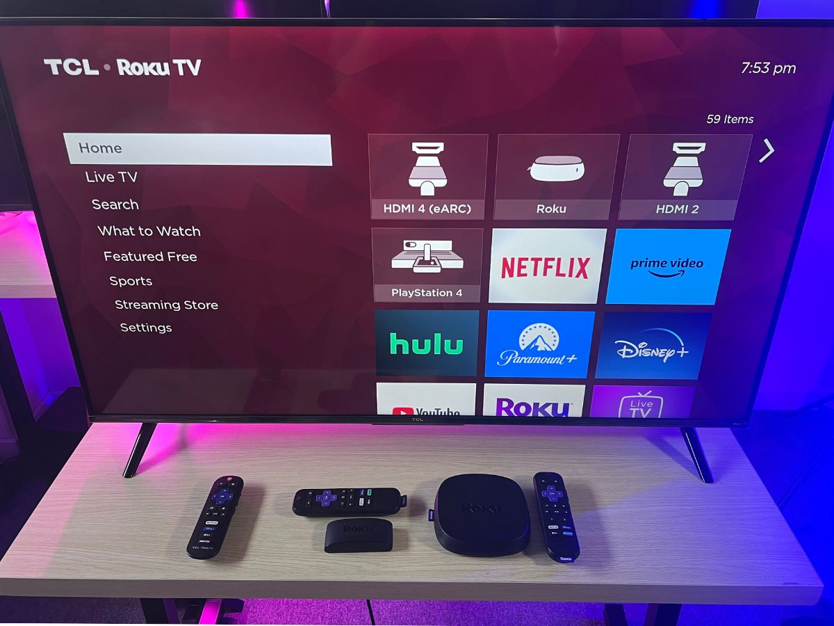 The interface of the TCL Roku TV with the Roku players on the table
