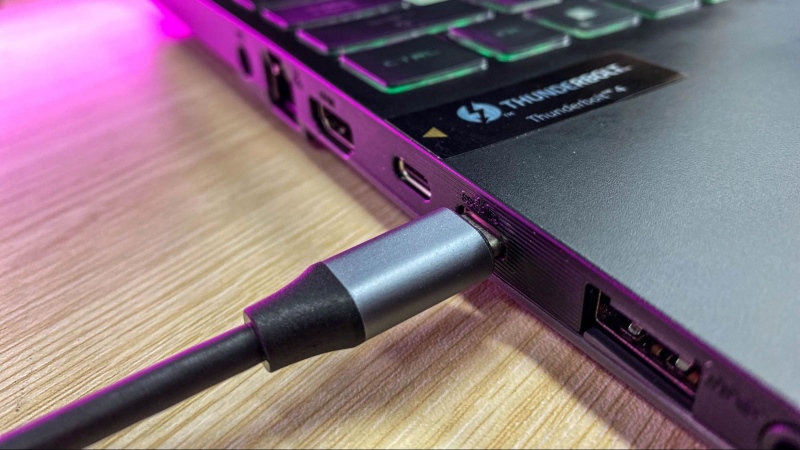 a USB-C to VGA adapter connects a monitor to a laptop