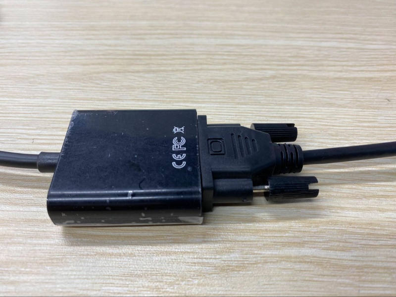 a VGA cable is connecting to a USB to VGA adapter