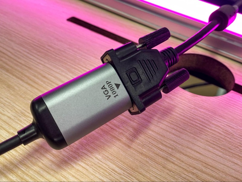 a VGA cable is connecting to the USB-C to VGA adapter
