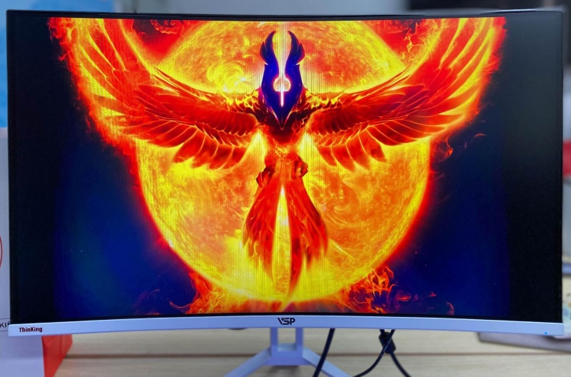 an external monitor is displaying a Phoenix wallpaper