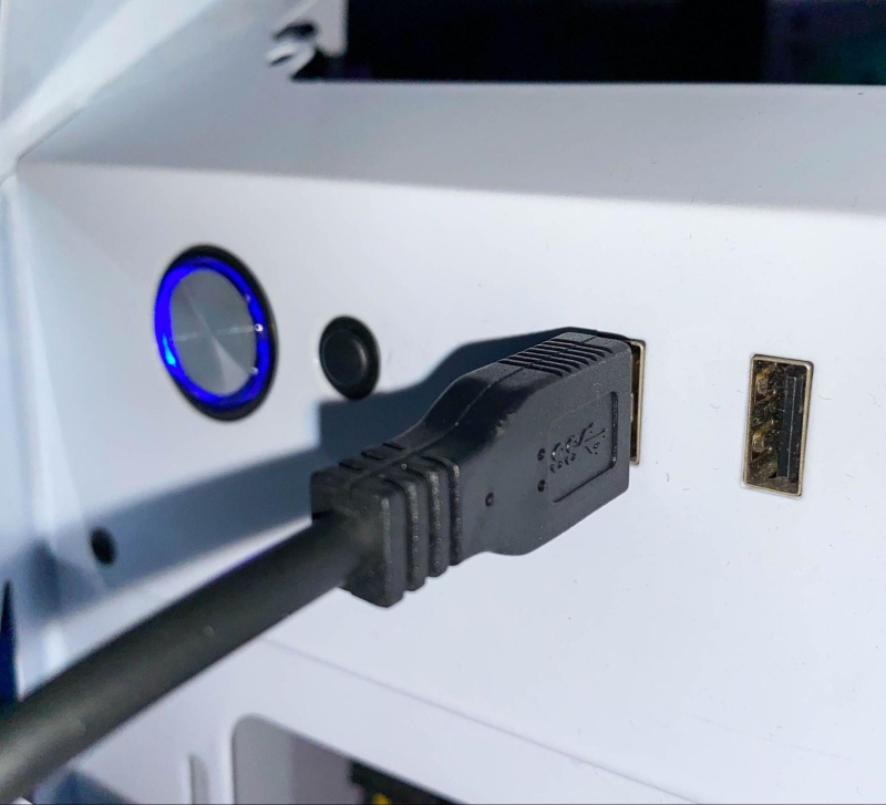 plug a USB cable into a PC