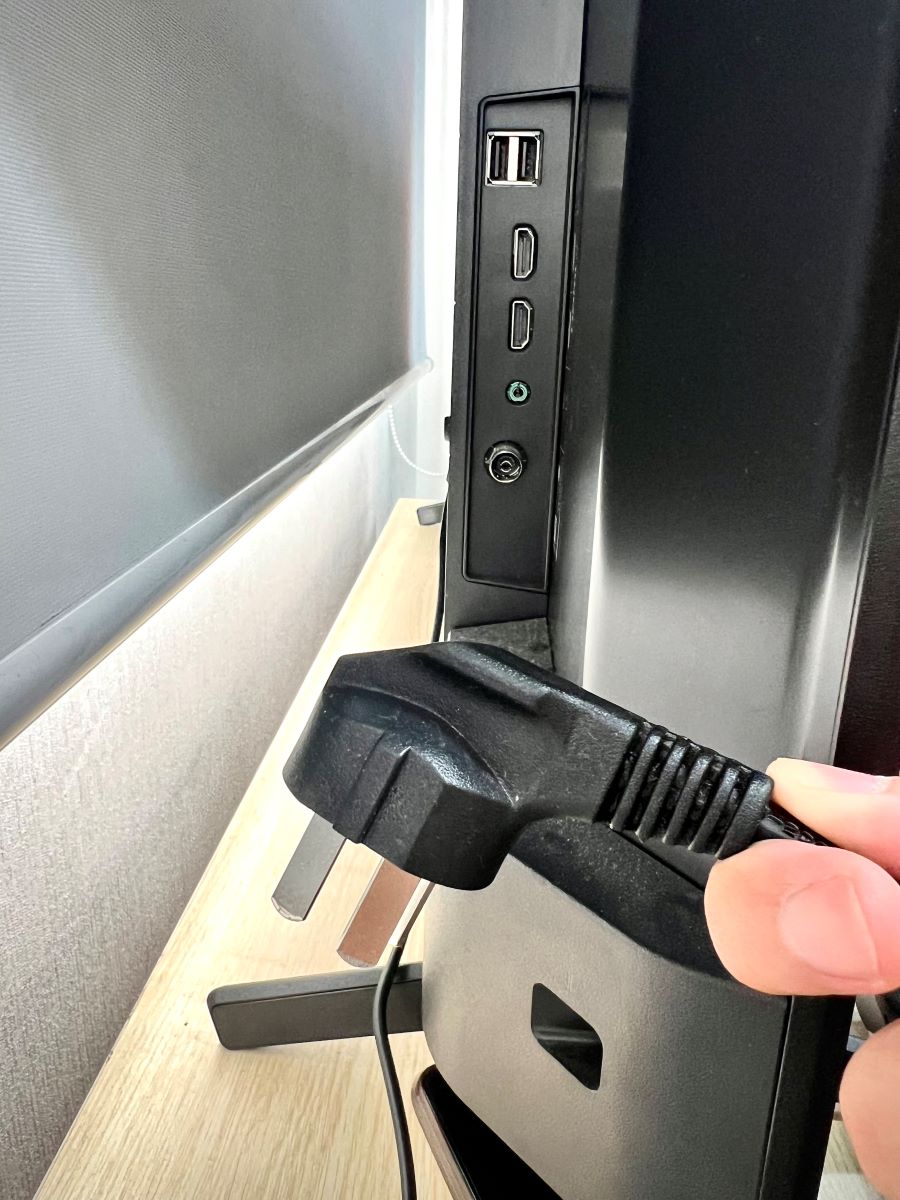 unplug the power cable from a tv
