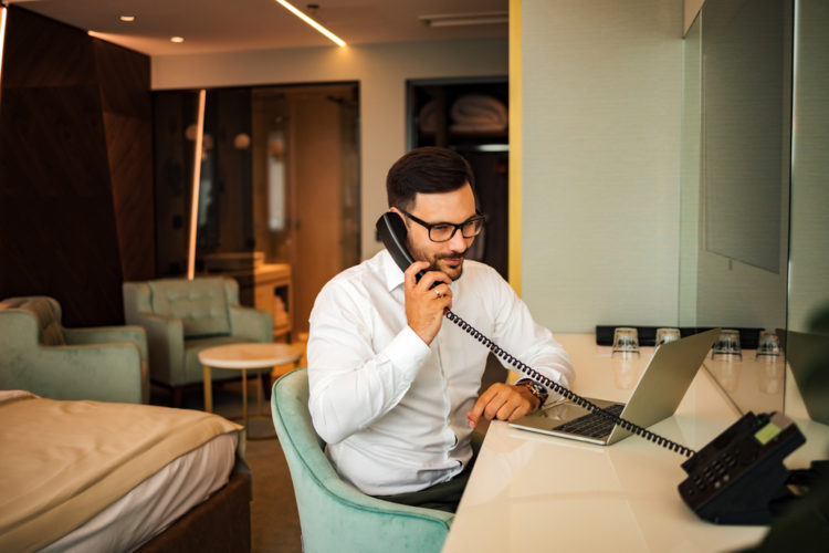 A man calling support in his Hotel room