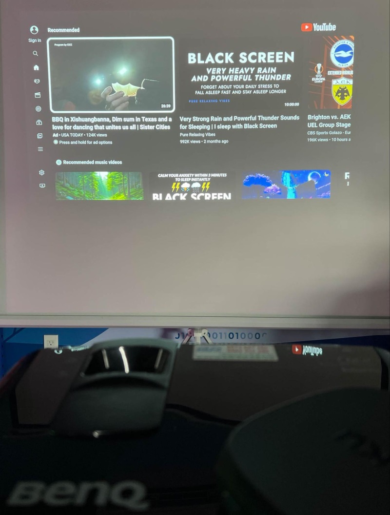 BenQ projector displaying a PC screen which plays Youtube
