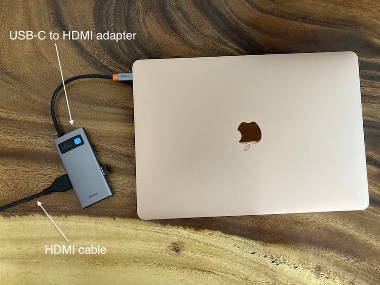 Connect a HDMI cable to an USB-C to HDMI adapter for Macbook Air