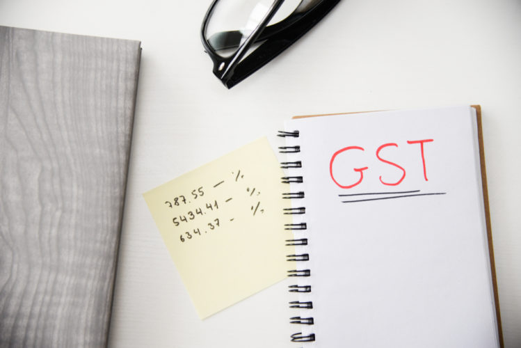 GST rate writing on a white paper