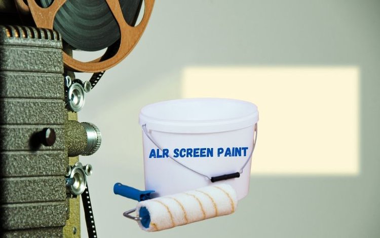 Projector showing on wall with paint bucket
