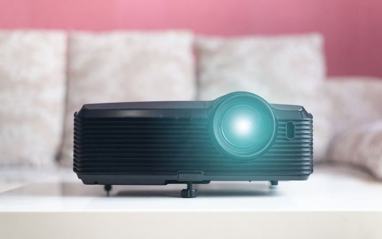 a black projector in a living room background