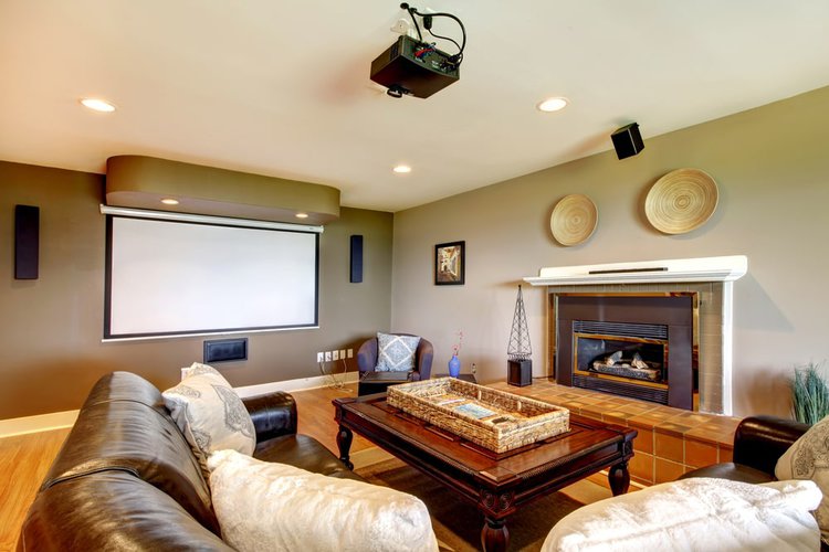 a projector screen in a home theater room