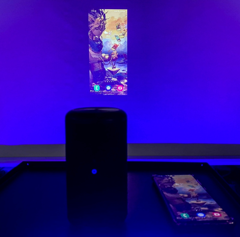 an Android phone screen is wireless mirrored to a Nebula projector