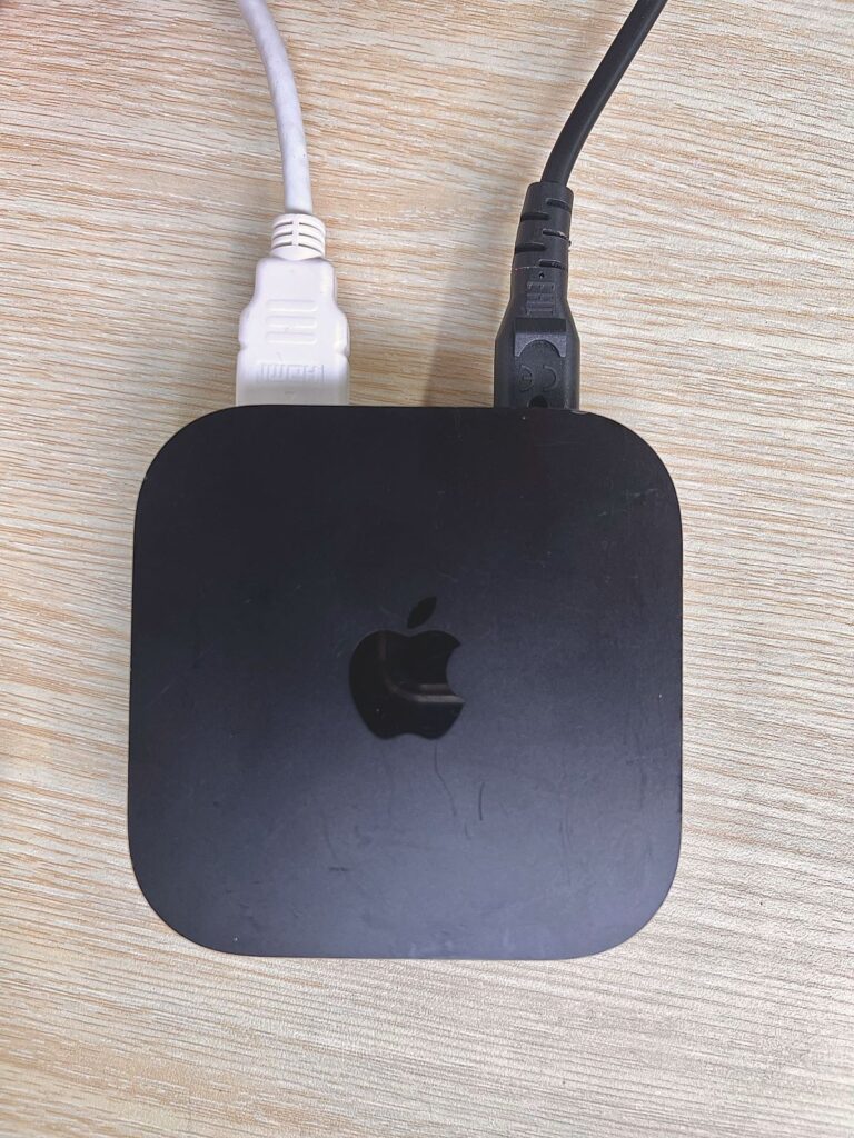 an hdmi cable is plugged into an apple tv 4k