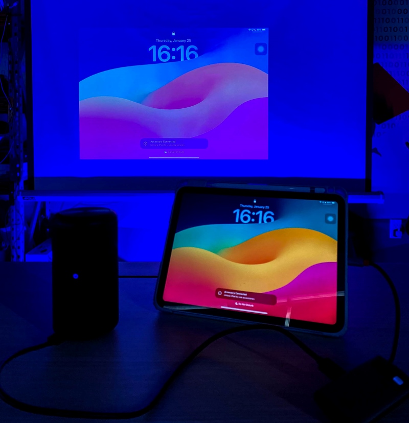 an iPad screen is wired and mirrored to a Nebula projector