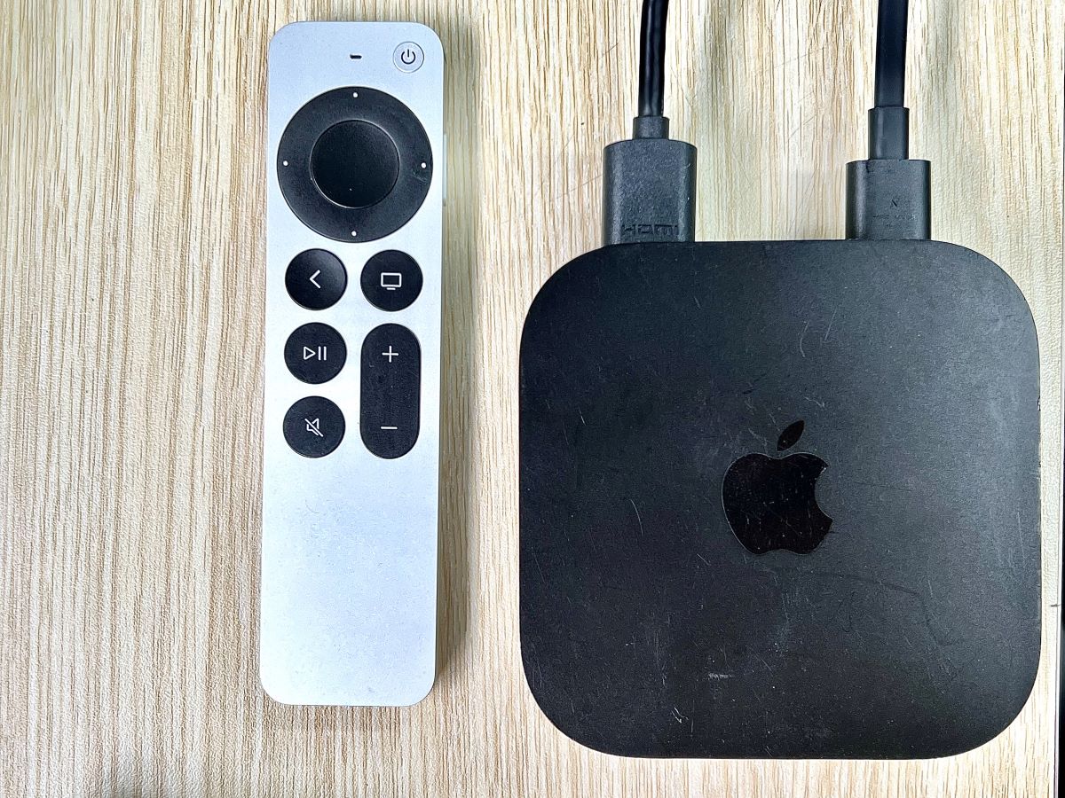 apple tv with its remote on a table