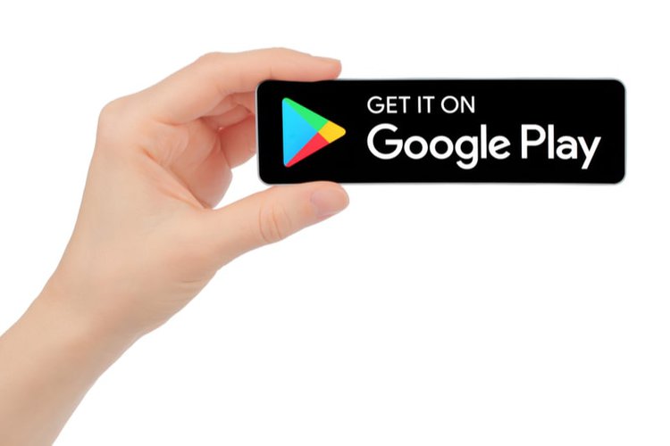 hand holding Google Play service icon
