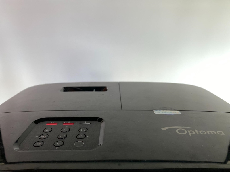 power and lamp indicators are red and steady on the Optoma projector control panel