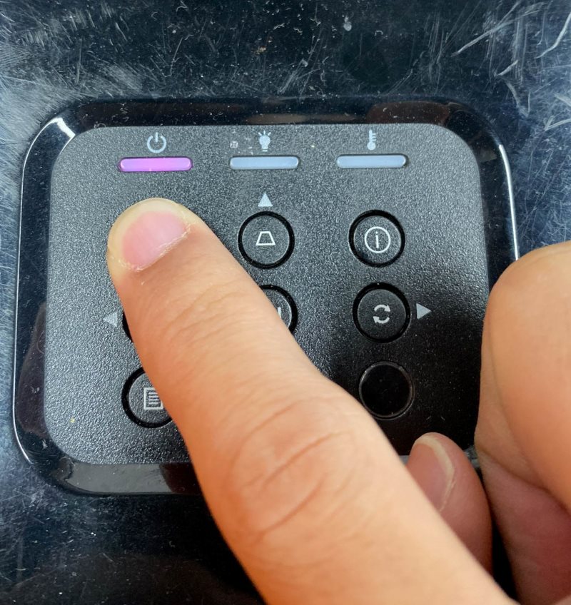 press the Optoma projector power button on the control panel while the power indicator flashes purple