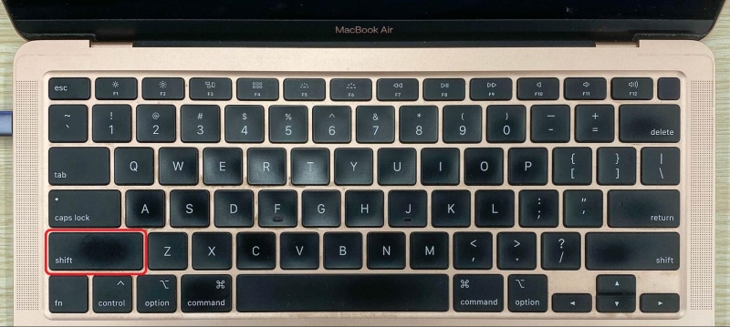 press the Shift key on the Macbook Air keyboard