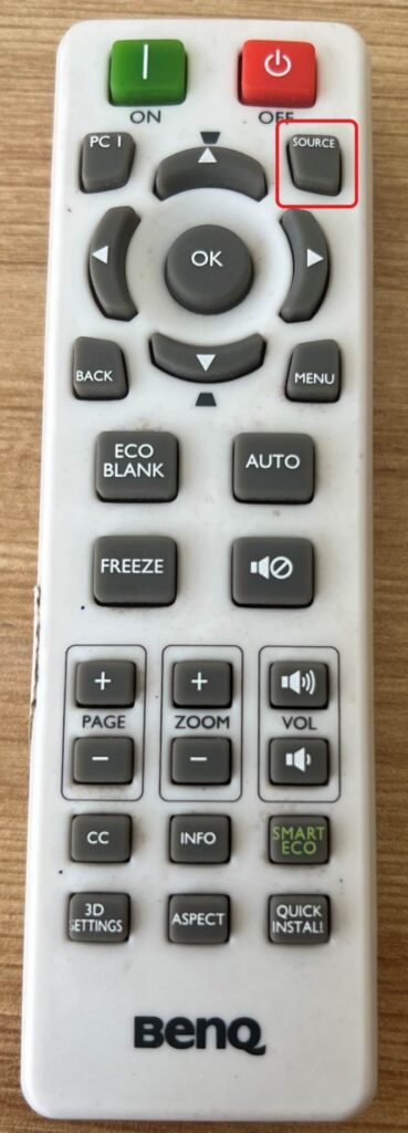 press the Source button on the BenQ projector remote