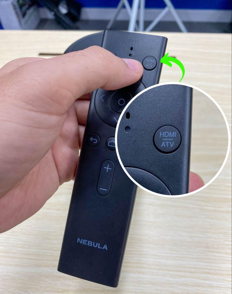 press the Source button on the Nebula projector remote