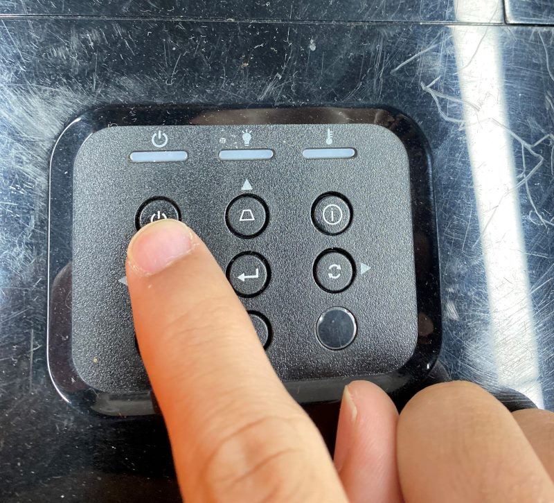 press the power button on the Optoma projector control panel