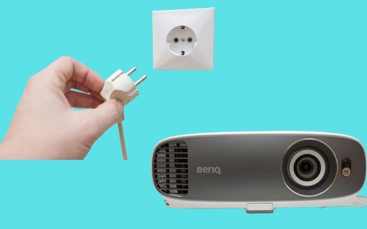 unplugging white cable and a BenQ projector