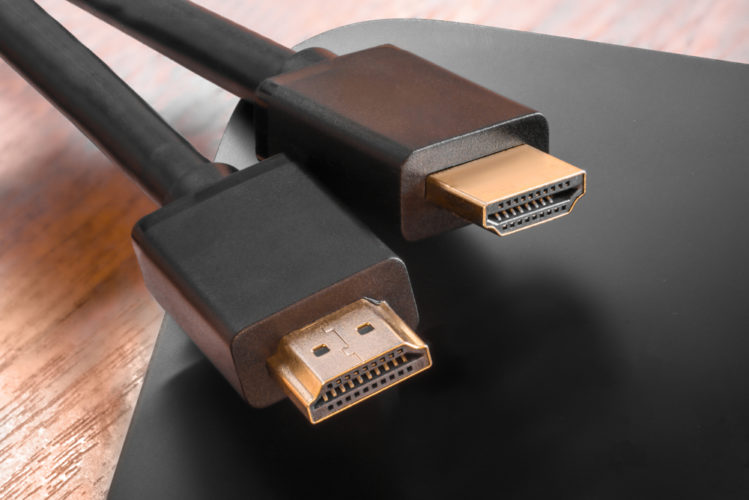 Black HDMI and Displayport cables on a laptop