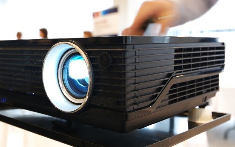 Pressing a function button on a projector